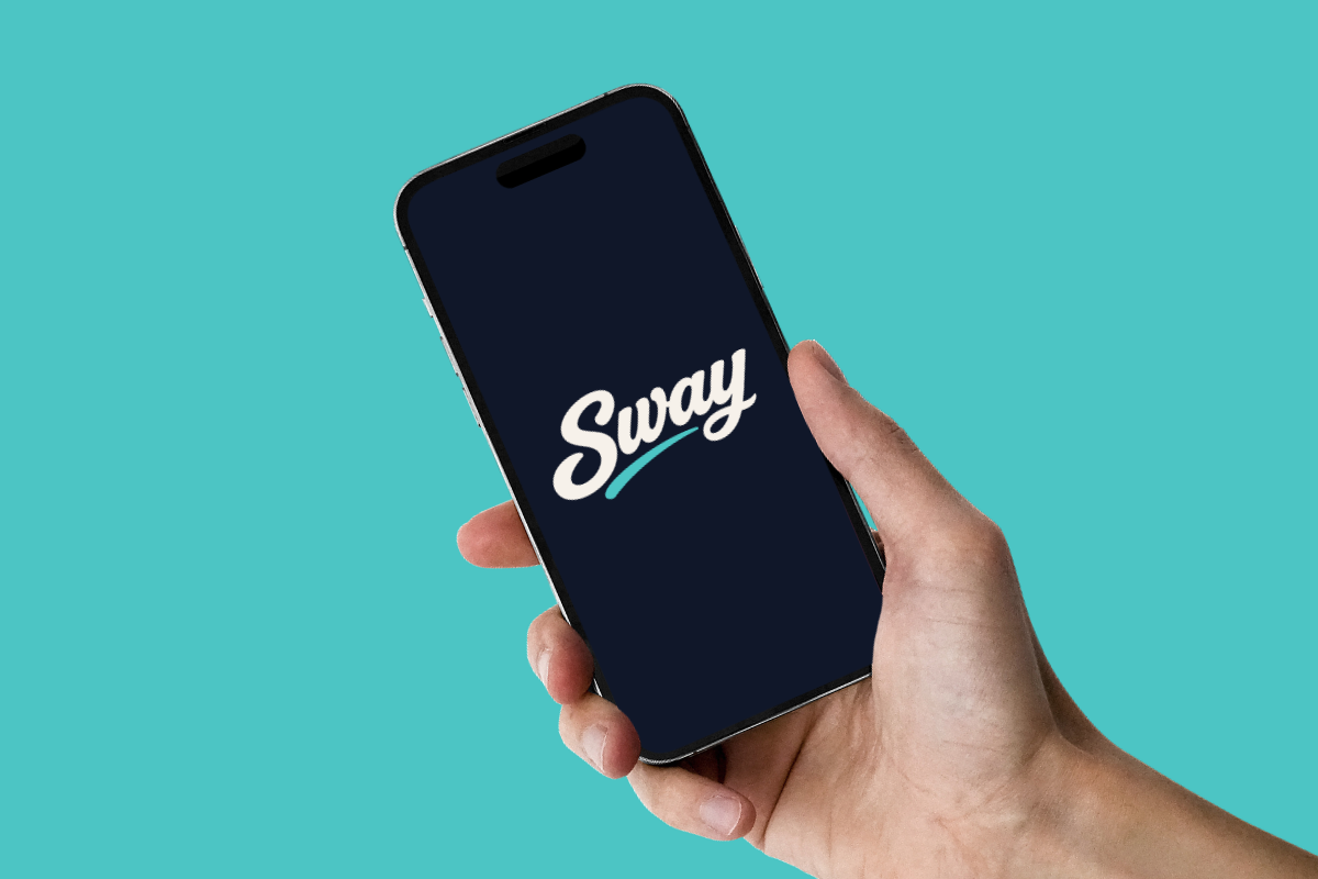 Hand holding a phone showing the Sway Business app